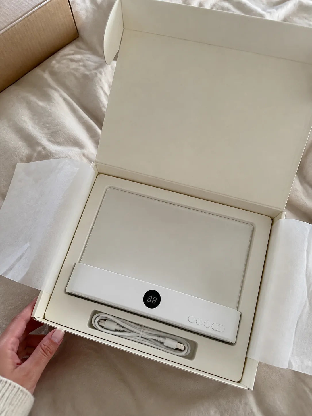 White Lumalli presented in premium warm ivory packaging